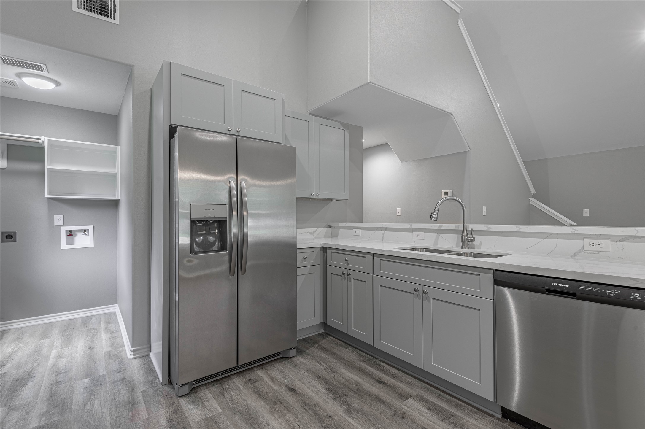 499 Pecan Onalaska, TX 77360 - Photo 11 of 30 a kitchen with stainless steel appliances granite countertop a sink and refrigerator