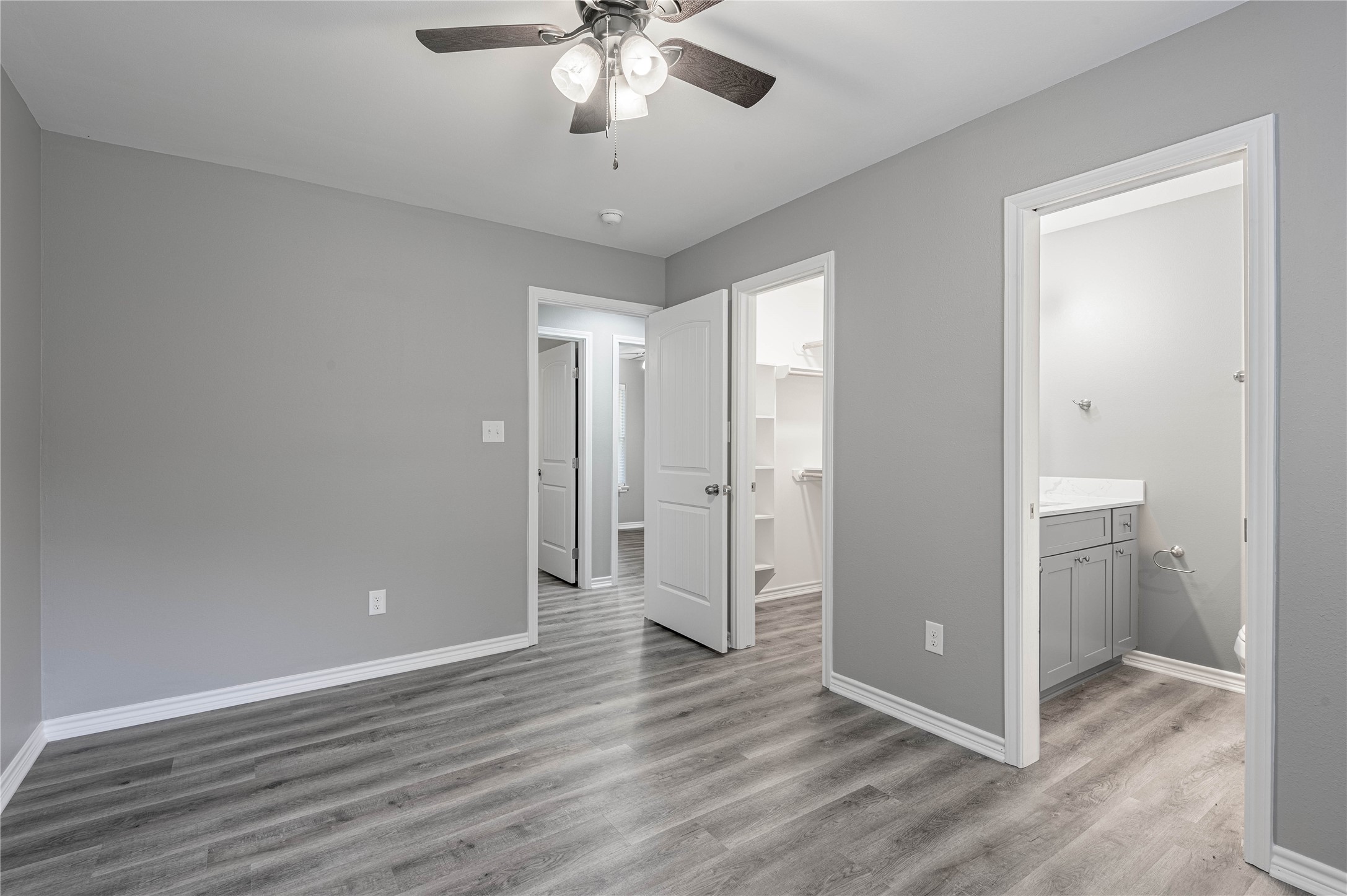 499 Pecan Onalaska, TX 77360 - Photo 16 of 30 an empty room with wooden floor and ceiling fan