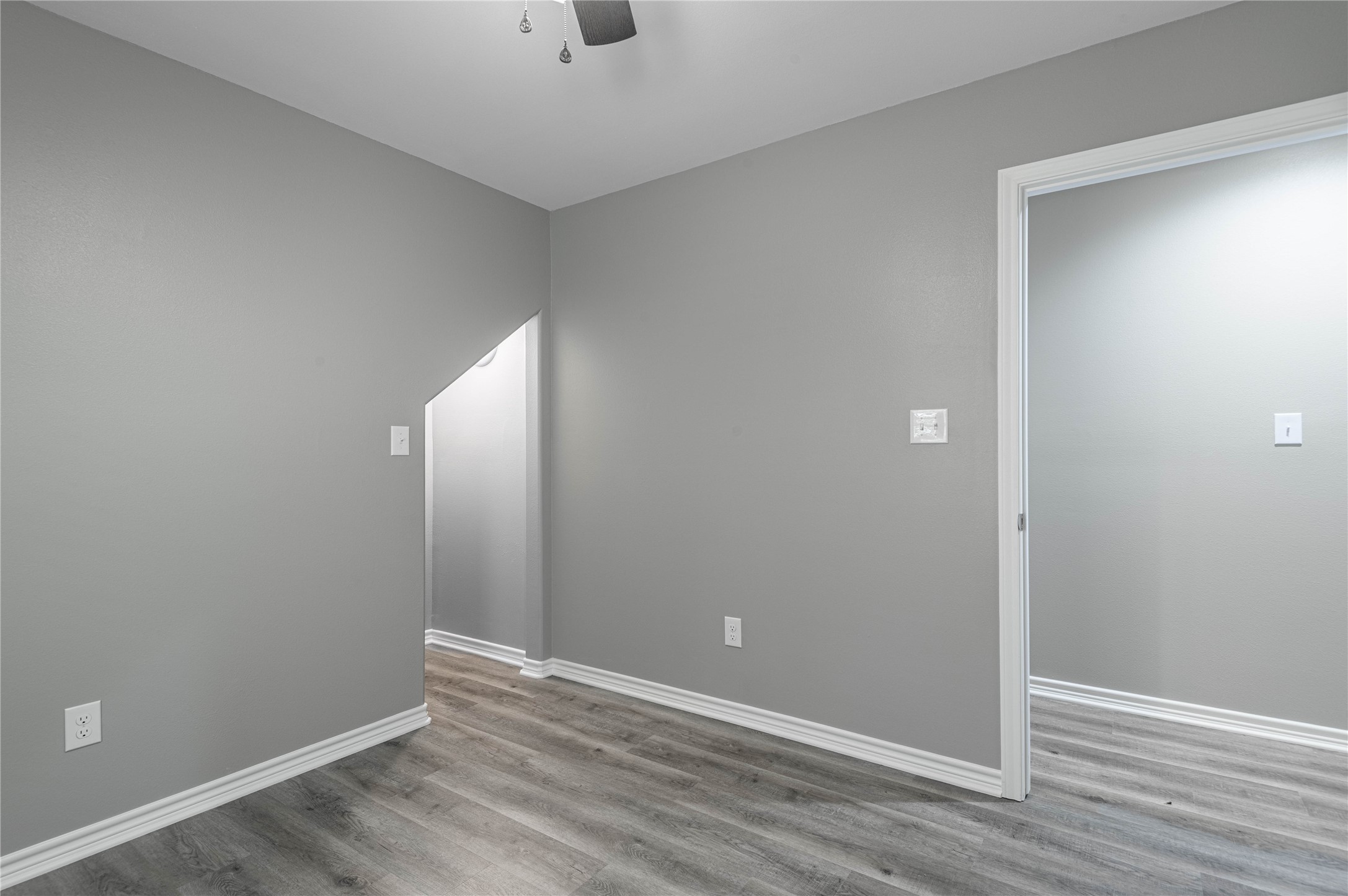 499 Pecan Onalaska, TX 77360 - Photo 23 of 30 an empty room with wooden floor and windows