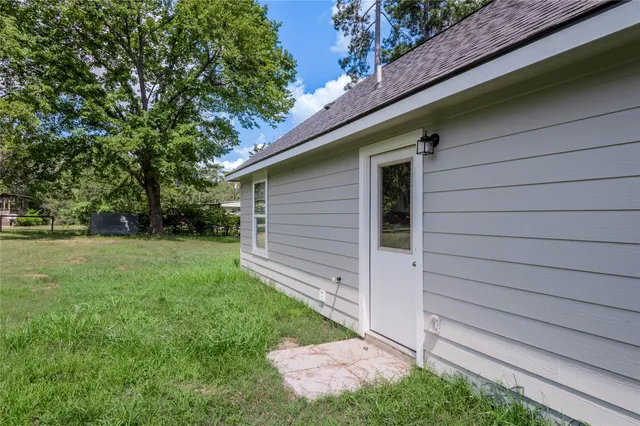 a backyard of a house with lots of green space