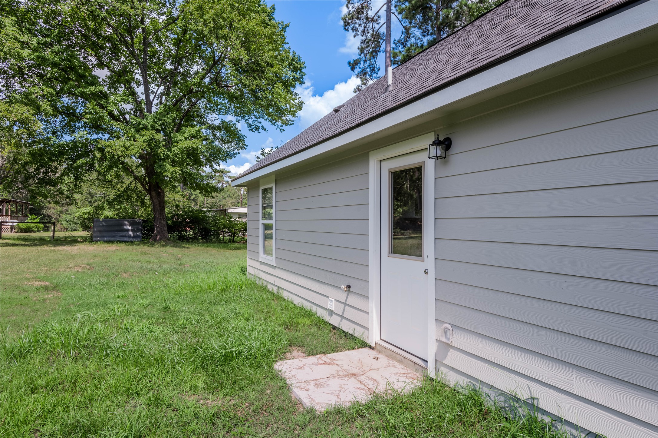 499 Pecan Onalaska, TX 77360 - Photo 28 of 30 a backyard of a house with lots of green space