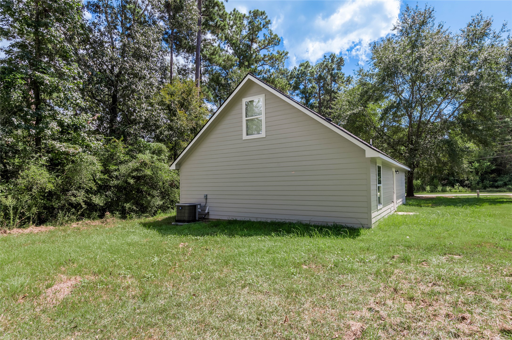 499 Pecan Onalaska, TX 77360 - Photo 30 of 30 a view of a backyard with potted plants and large tree