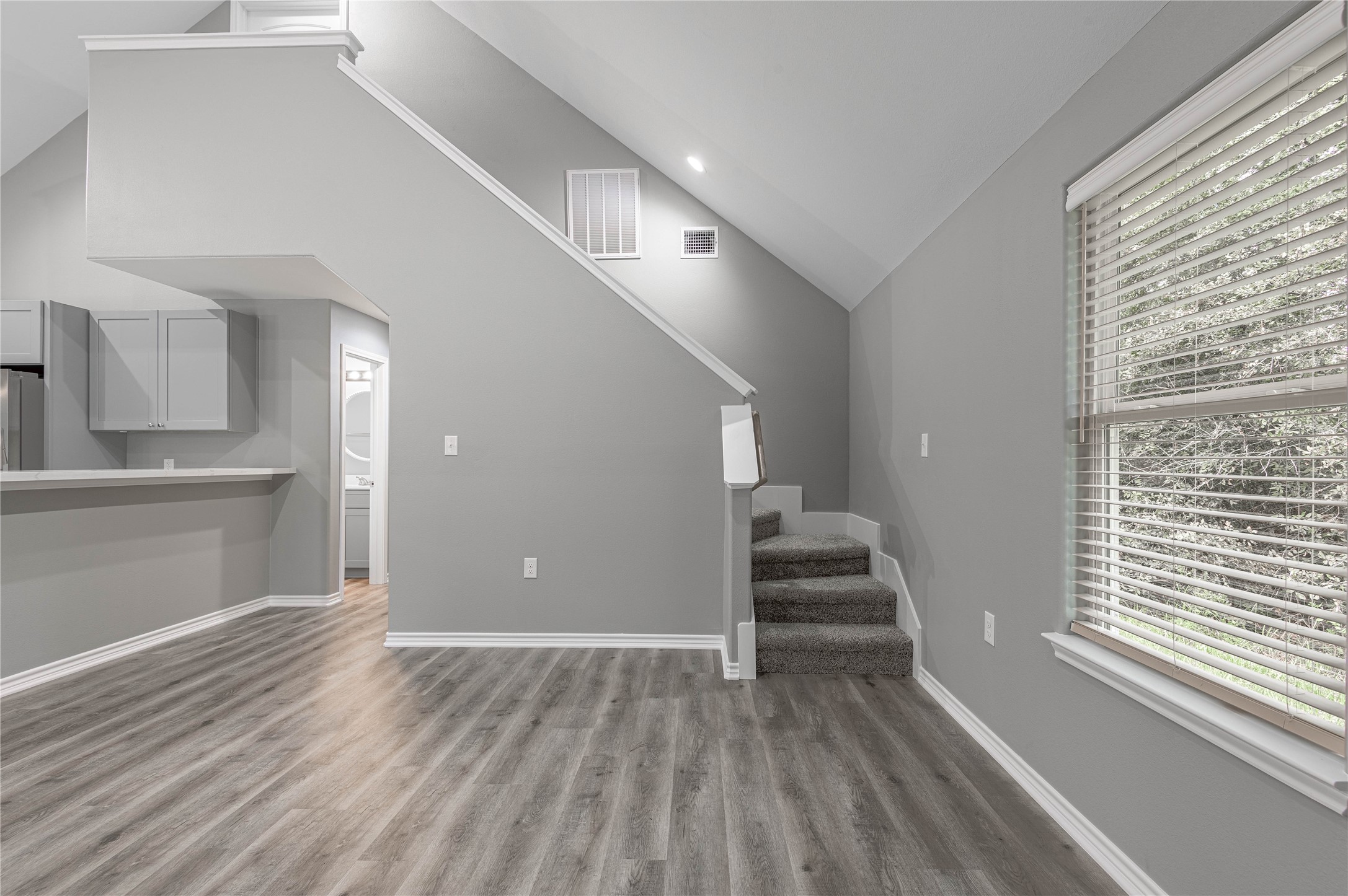 499 Pecan Onalaska, TX 77360 - Photo 5 of 30 a view of a livingroom with wooden floor and stairs