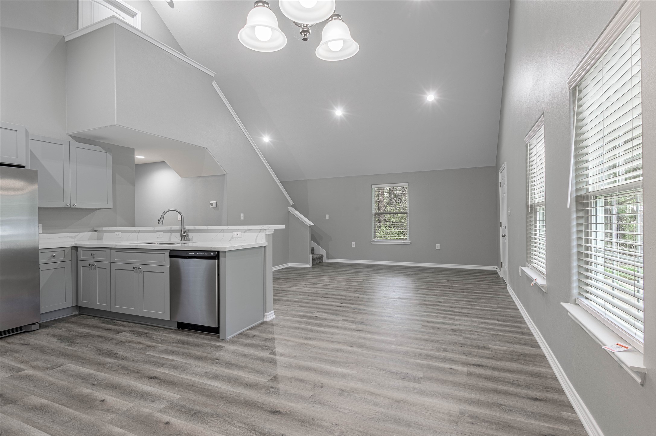 499 Pecan Onalaska, TX 77360 - Photo 9 of 30 a view of a kitchen with a sink and wooden floor