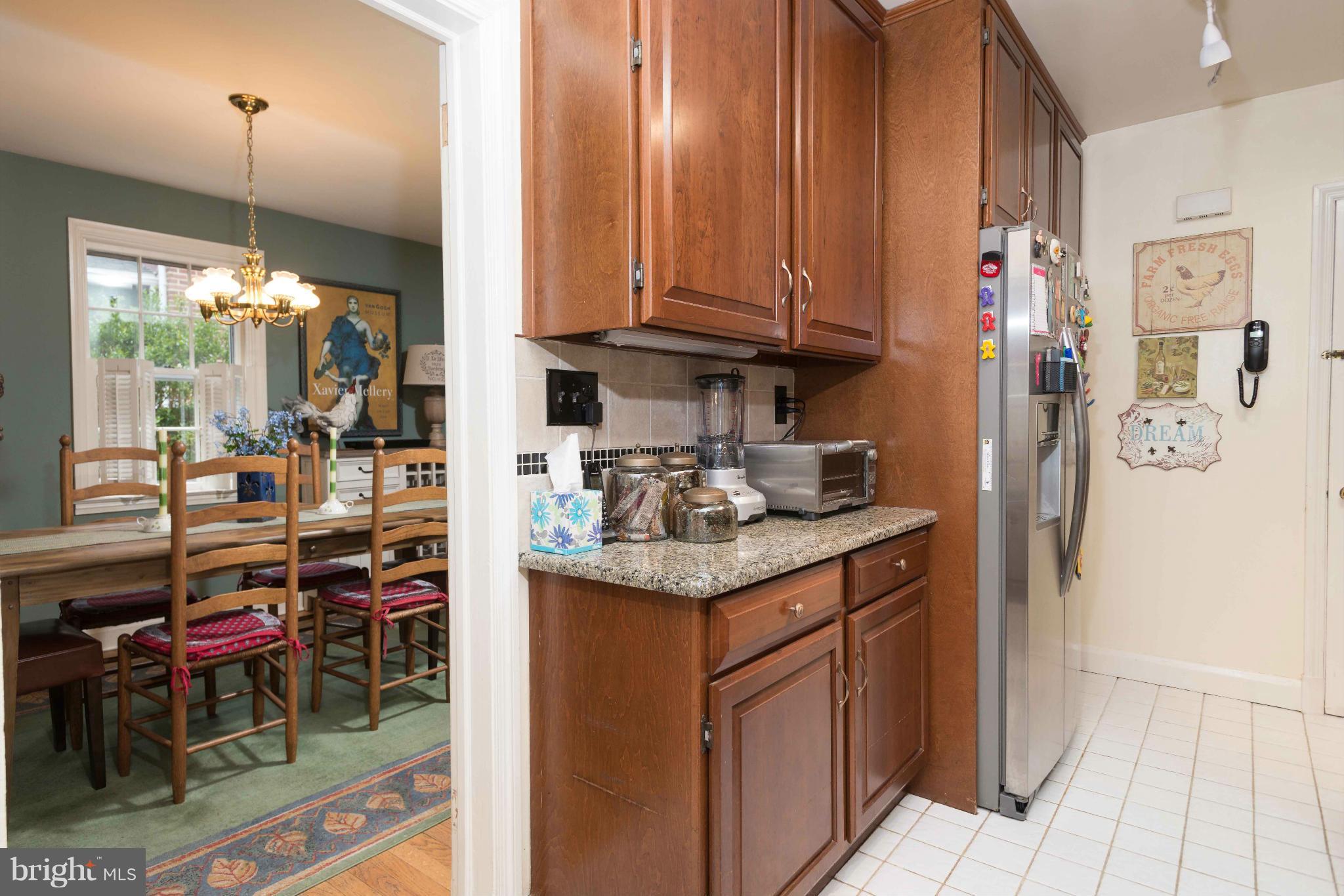 6420 Pinehurst Road Baltimore, MD 21212 - Photo 11 of 30 a kitchen with stainless steel appliances granite countertop a refrigerator and a stove