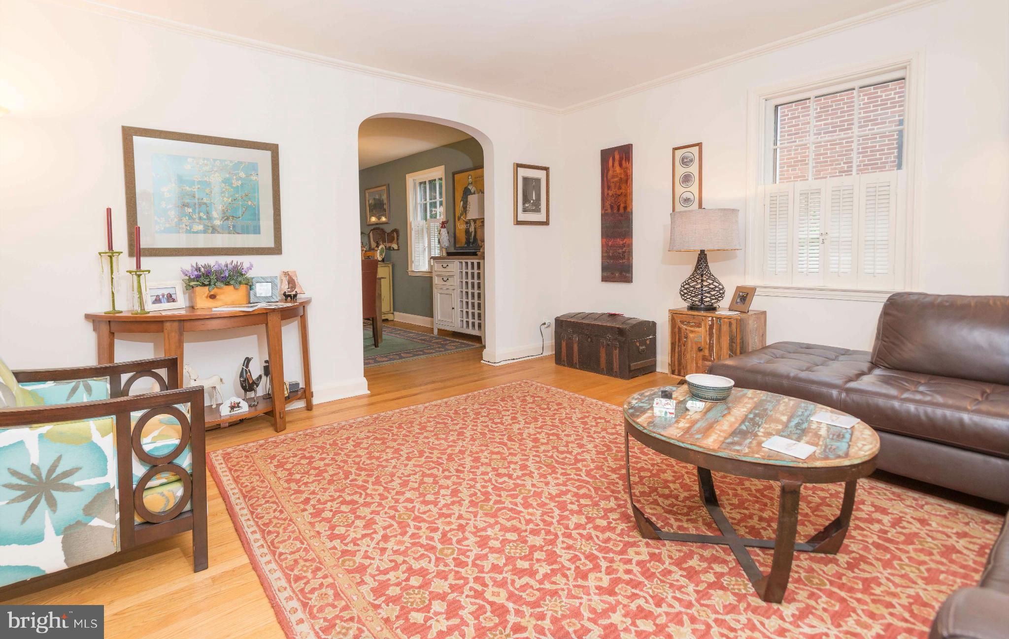 6420 Pinehurst Road Baltimore, MD 21212 - Photo 5 of 30 a living room with furniture a rug and a window