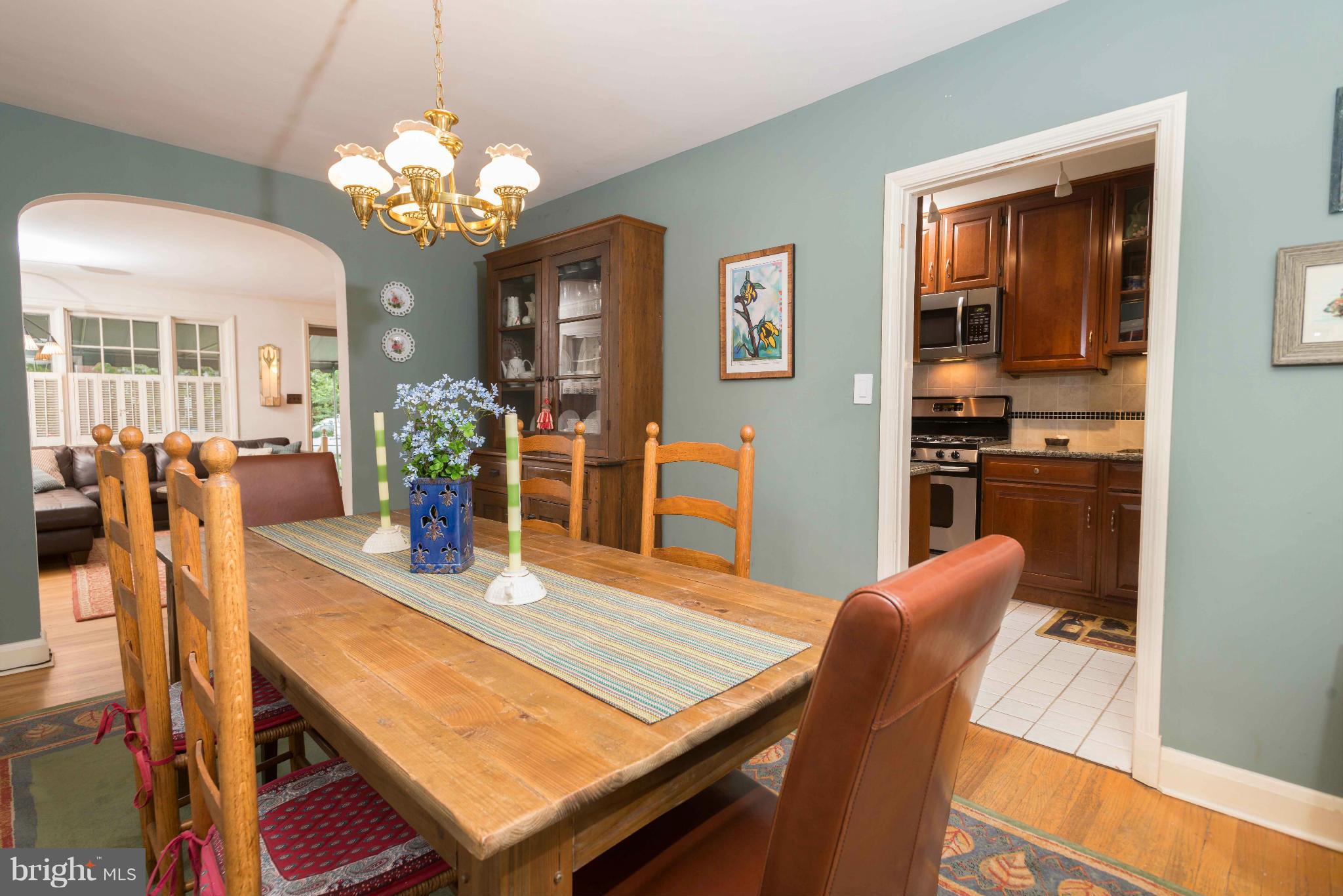6420 Pinehurst Road Baltimore, MD 21212 - Photo 6 of 30 a view of a dining room with furniture and chandelier