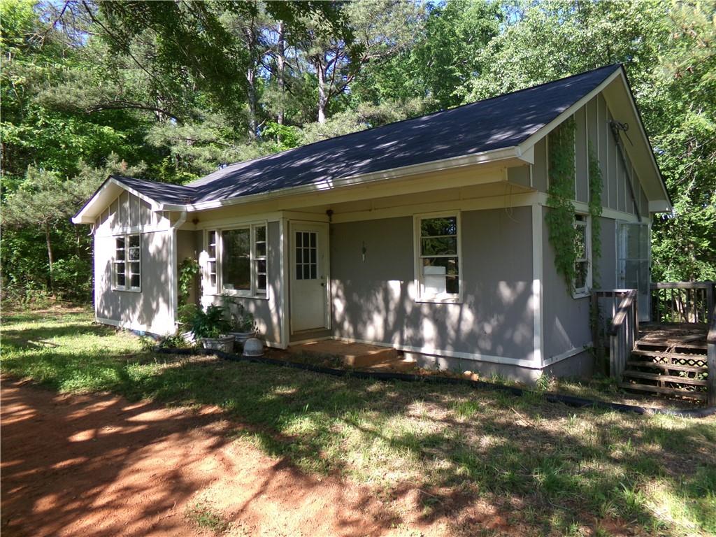 3905 Highway 138 Covington, GA 30014 - Photo 32 of 40 a front view of a house with a yard
