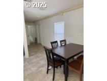 5000 Northeast Stephens Street, Unit 27 Roseburg, OR 97470 - Photo 5 of 24 a view of a room with a table and chairs