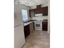 5000 Northeast Stephens Street, Unit 27 Roseburg, OR 97470 - Photo 6 of 24 a kitchen with a sink and a stove
