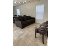 5000 Northeast Stephens Street, Unit 27 Roseburg, OR 97470 - Photo 9 of 24 a living room with furniture and a piano