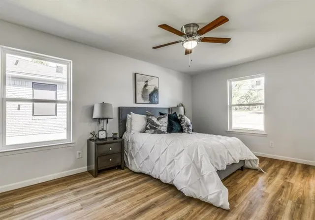 a bedroom with a bed and window