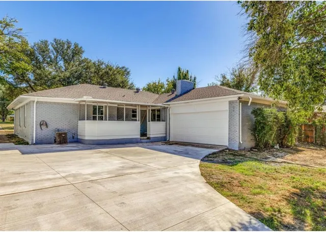 a front view of house with yard outdoor seating and barbeque oven