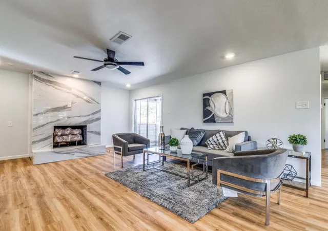 a living room with furniture and a fireplace
