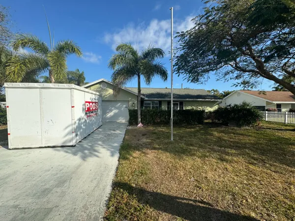 a view of swimming pool with a yard