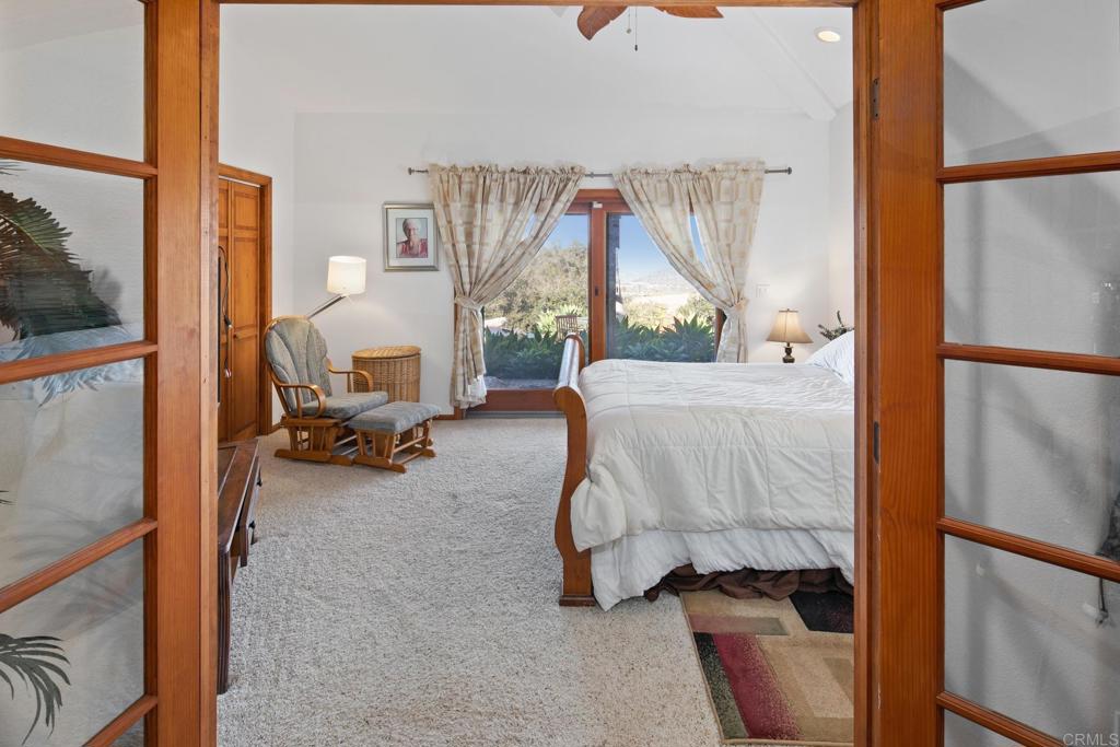 589 Anderson Road Alpine, CA 91901 - Photo 31 of 54 a bedroom with furniture and a window