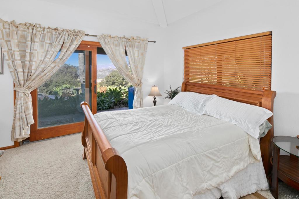 589 Anderson Road Alpine, CA 91901 - Photo 34 of 54 a bed sitting in a bedroom next to a window