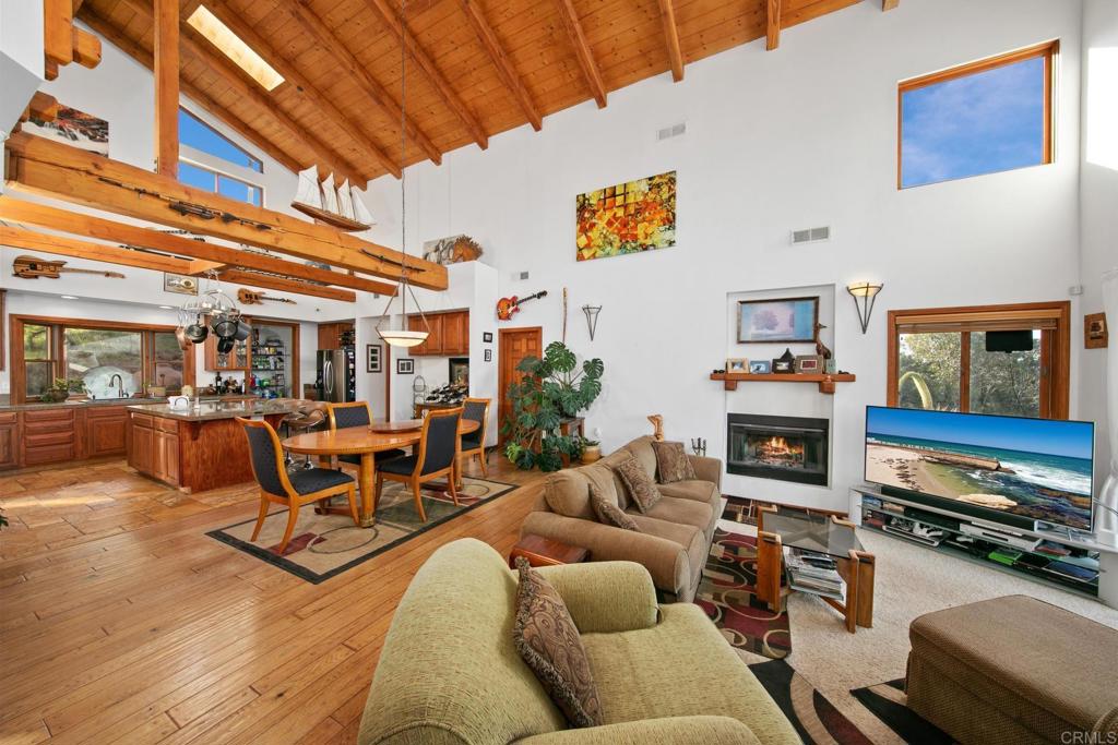 589 Anderson Road Alpine, CA 91901 - Photo 37 of 54 a living room with furniture a fireplace and a flat screen tv