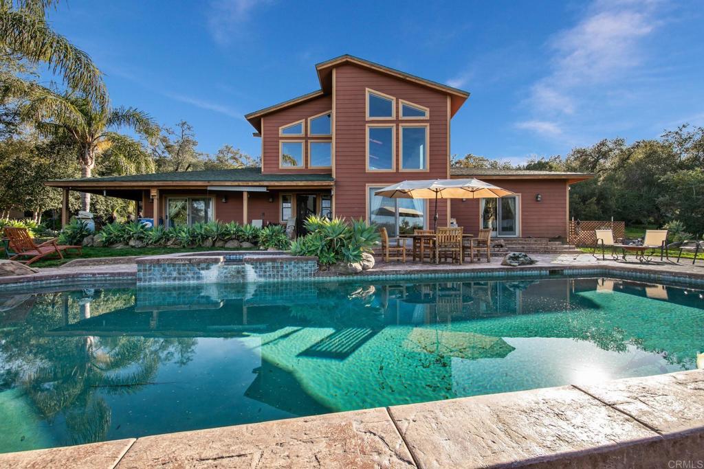 589 Anderson Road Alpine, CA 91901 - Photo 38 of 54 a front view of a house with a yard table and chairs