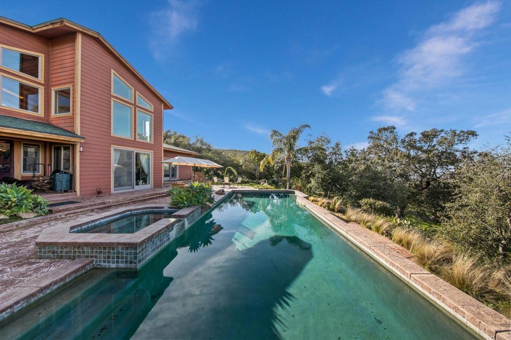 589 Anderson Road Alpine, CA 91901 - Photo 40 of 54 a front view of a house with a yard and lake view