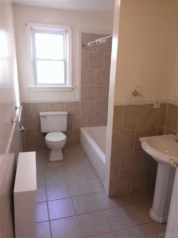 a bathroom with a sink a toilet and a bathtub