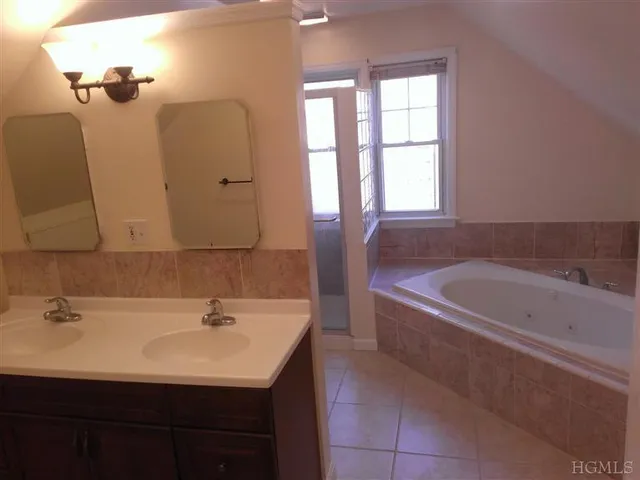 a bathroom with a bathtub and a sink