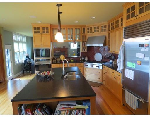 38 Ridge View Road Northampton, MA 01062 - Photo 4 of 30 a large kitchen with stainless steel appliances granite countertop a stove a sink a dining table and chairs