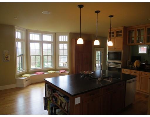 38 Ridge View Road Northampton, MA 01062 - Photo 6 of 30 a kitchen with a table chairs and flat screen tv