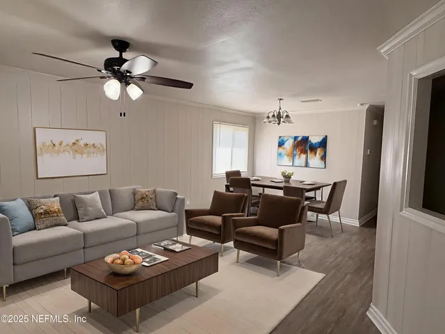 a living room with furniture a rug and a window