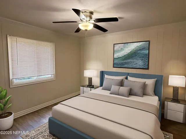 a bedroom with a bed and a painting on the wall