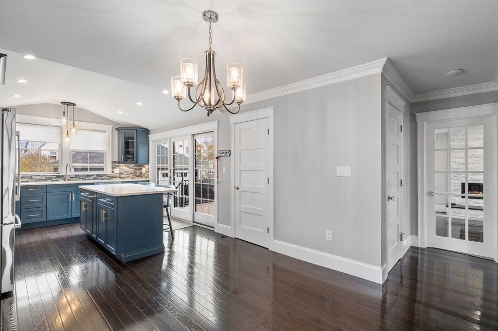43 O'Neil Street Hudson, MA 01749 - Photo 15 of 39 a large kitchen with a lot of counter space and wooden floor