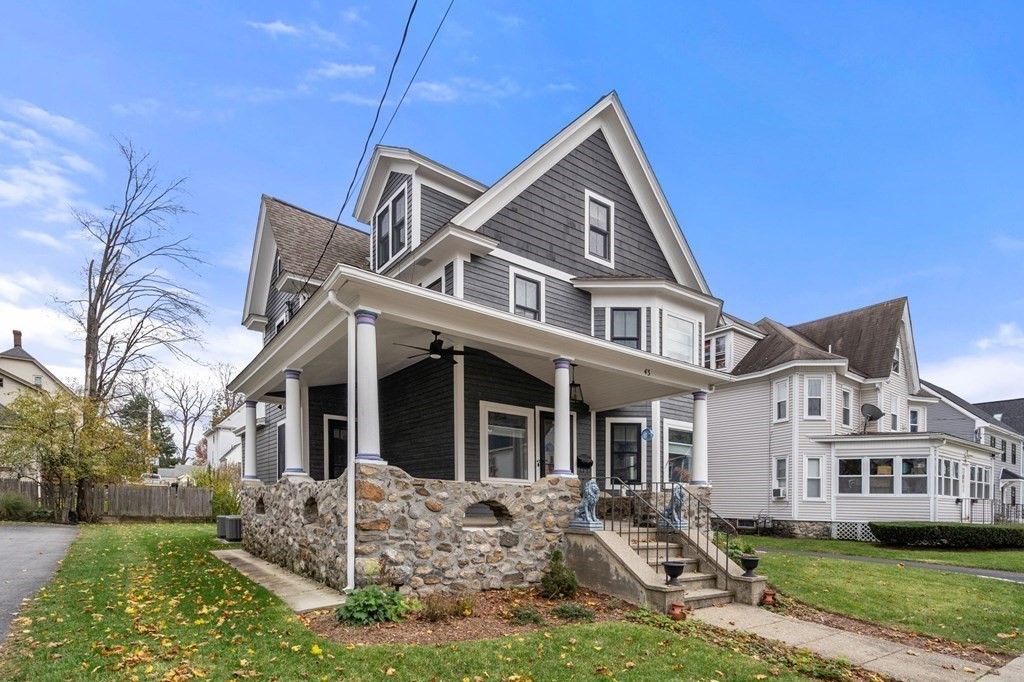 43 O'Neil Street Hudson, MA 01749 - Photo 2 of 39 a front view of a house with garden
