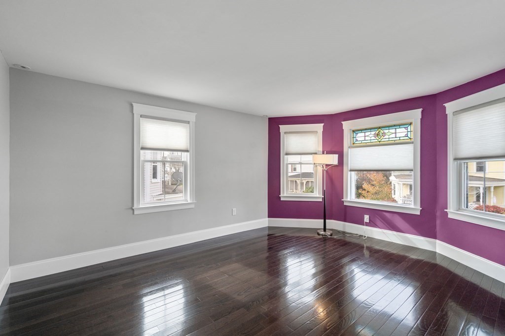 43 O'Neil Street Hudson, MA 01749 - Photo 23 of 39 a view of an empty room with wooden floor and a window