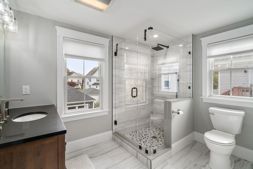 43 O'Neil Street Hudson, MA 01749 - Photo 26 of 39 a bathroom with a sink toilet and shower