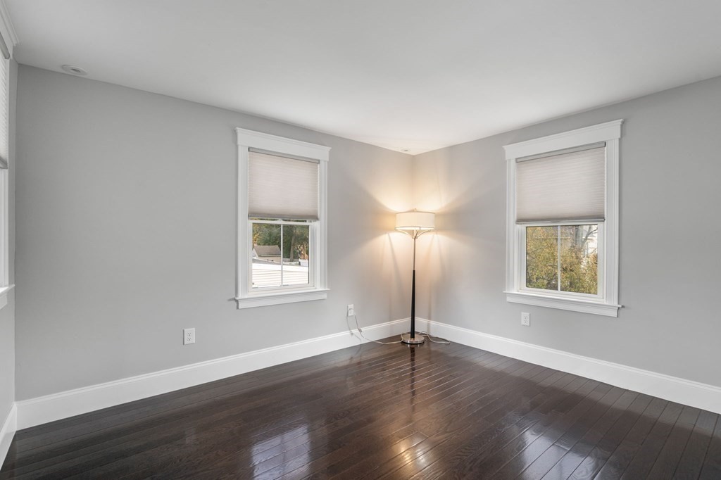 43 O'Neil Street Hudson, MA 01749 - Photo 27 of 39 a view of an empty room with wooden floor and a window