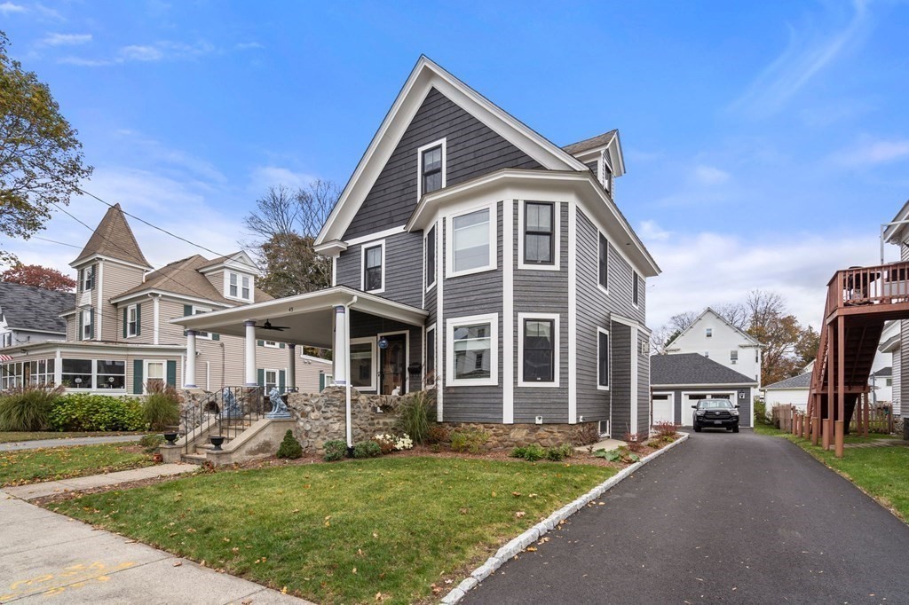 43 O'Neil Street Hudson, MA 01749 - Photo 3 of 39 a front view of a house with a yard