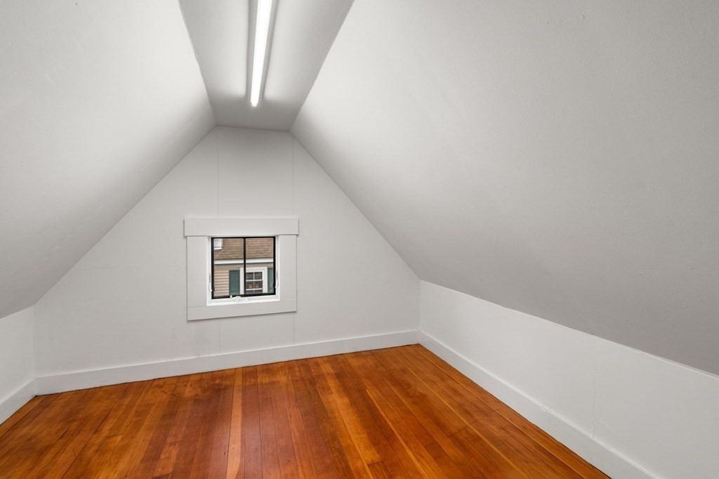 43 O'Neil Street Hudson, MA 01749 - Photo 32 of 39 a view of an empty room with wooden floor and a window