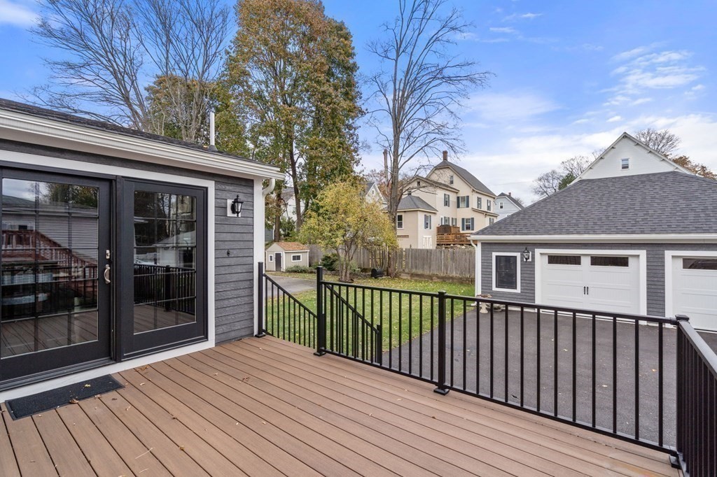 43 O'Neil Street Hudson, MA 01749 - Photo 33 of 39 a view of a house with a small yard and wooden fence
