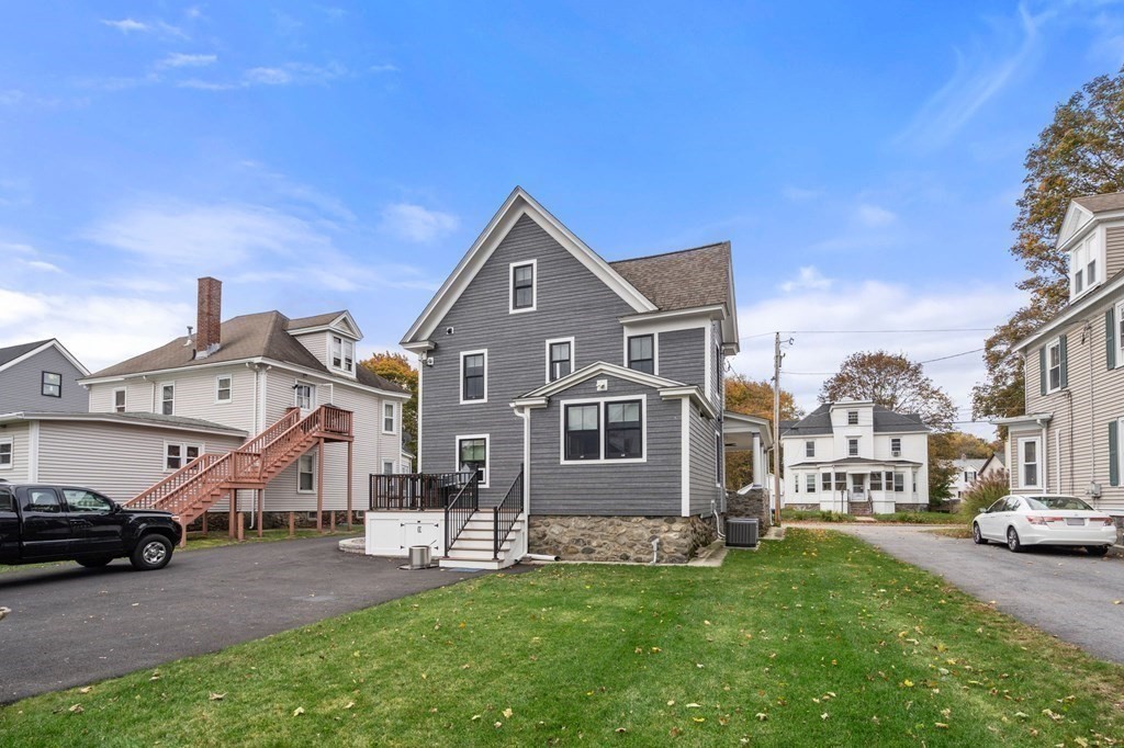 43 O'Neil Street Hudson, MA 01749 - Photo 35 of 39 a front view of a house with a garden