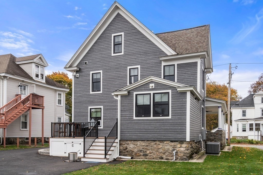 43 O'Neil Street Hudson, MA 01749 - Photo 36 of 39 a front view of a house with a yard