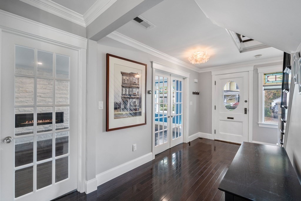 43 O'Neil Street Hudson, MA 01749 - Photo 8 of 39 a view of empty room with wooden floor and windows