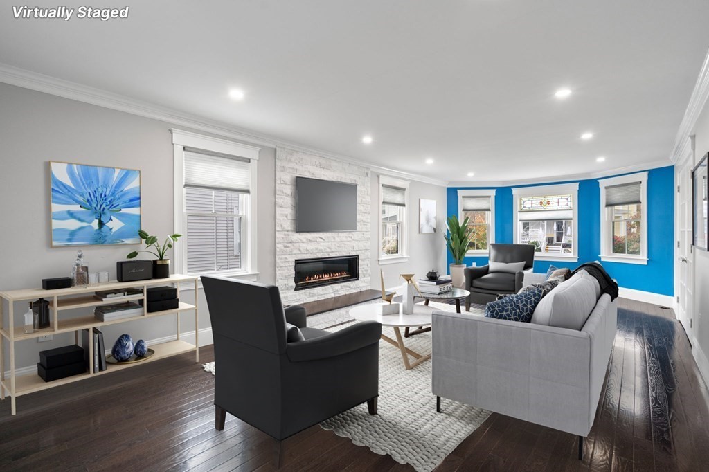 43 O'Neil Street Hudson, MA 01749 - Photo 9 of 39 a living room with fireplace furniture and a flat screen tv