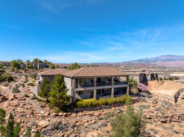 2376 Stone Crest Circle St. George, UT 84790 - Photo 52 of 61 Rear view of house featuring stucco siding, a mountain view, and a balcony