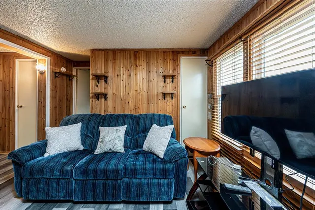a kitchen with stainless steel appliances granite countertop a sink and a refrigerator