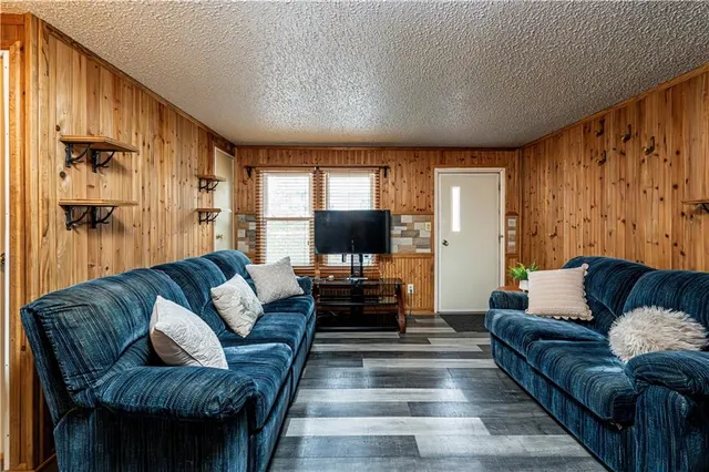 a kitchen with stainless steel appliances granite countertop a sink and cabinets