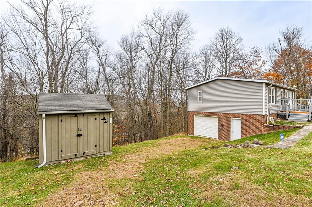 303 Mt Manor Road Manor, PA 15665 - Photo 6 of 43 SHED IS ALSO PART OF THE PROPERTY. The garage door was covered over to bring the basement up to code. See next pic.