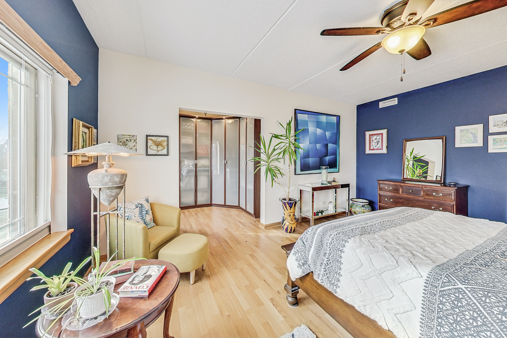 911 Busse Highway, Unit 204 Park Ridge, IL 60068 - Photo 16 of 31 a bedroom with a bed and a chandelier