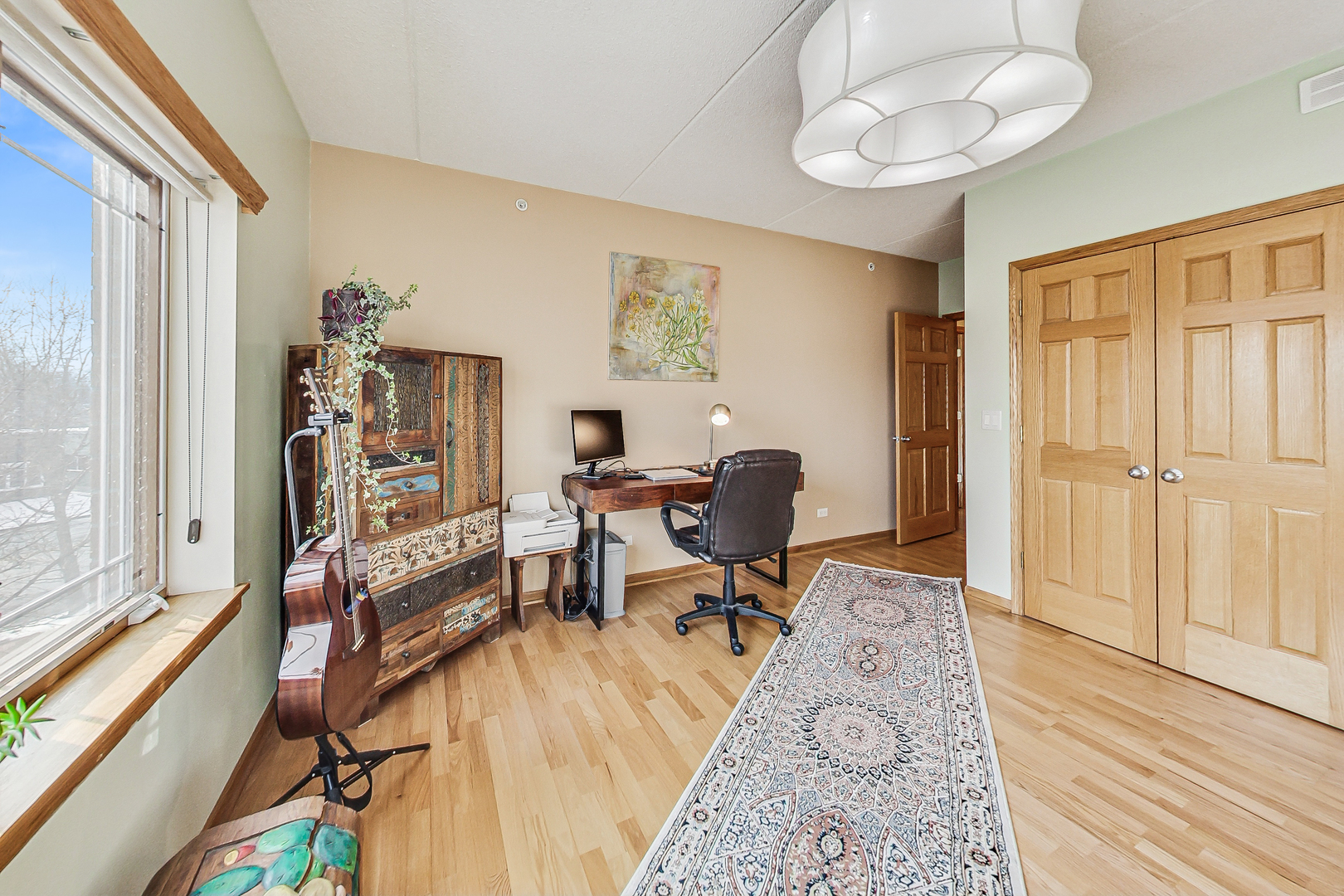 911 Busse Highway, Unit 204 Park Ridge, IL 60068 - Photo 21 of 31 a view of a workspace with furniture and a window