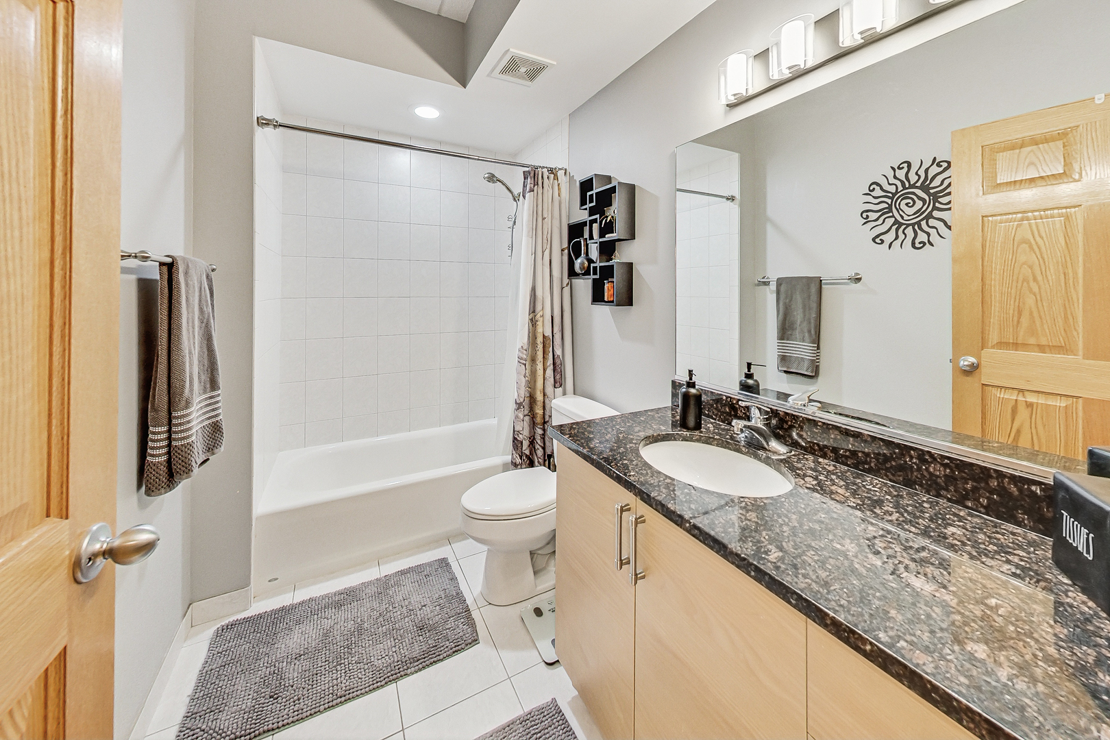 911 Busse Highway, Unit 204 Park Ridge, IL 60068 - Photo 22 of 31 a bathroom with a granite countertop sink toilet and shower