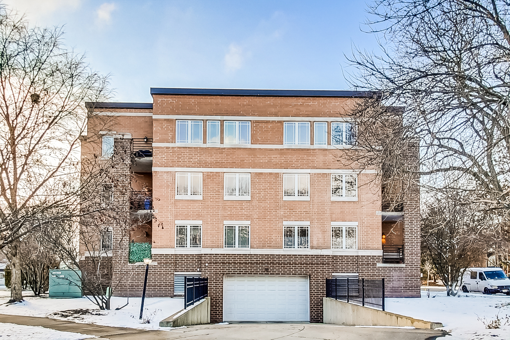 911 Busse Highway, Unit 204 Park Ridge, IL 60068 - Photo 27 of 31 a front view of a building with a garden